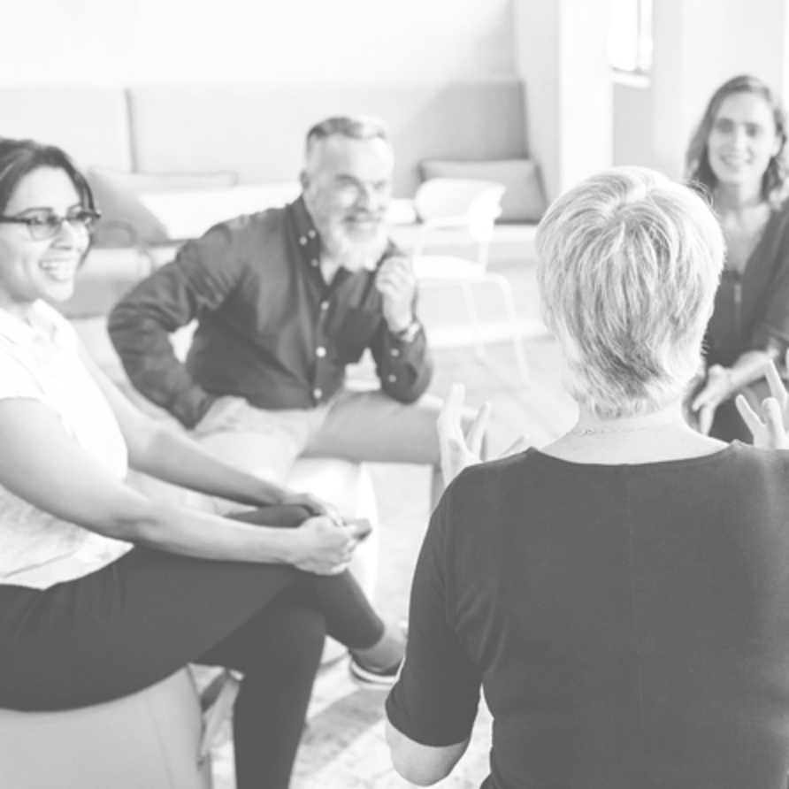 Fragrance oils team sat in a circle for a meeting